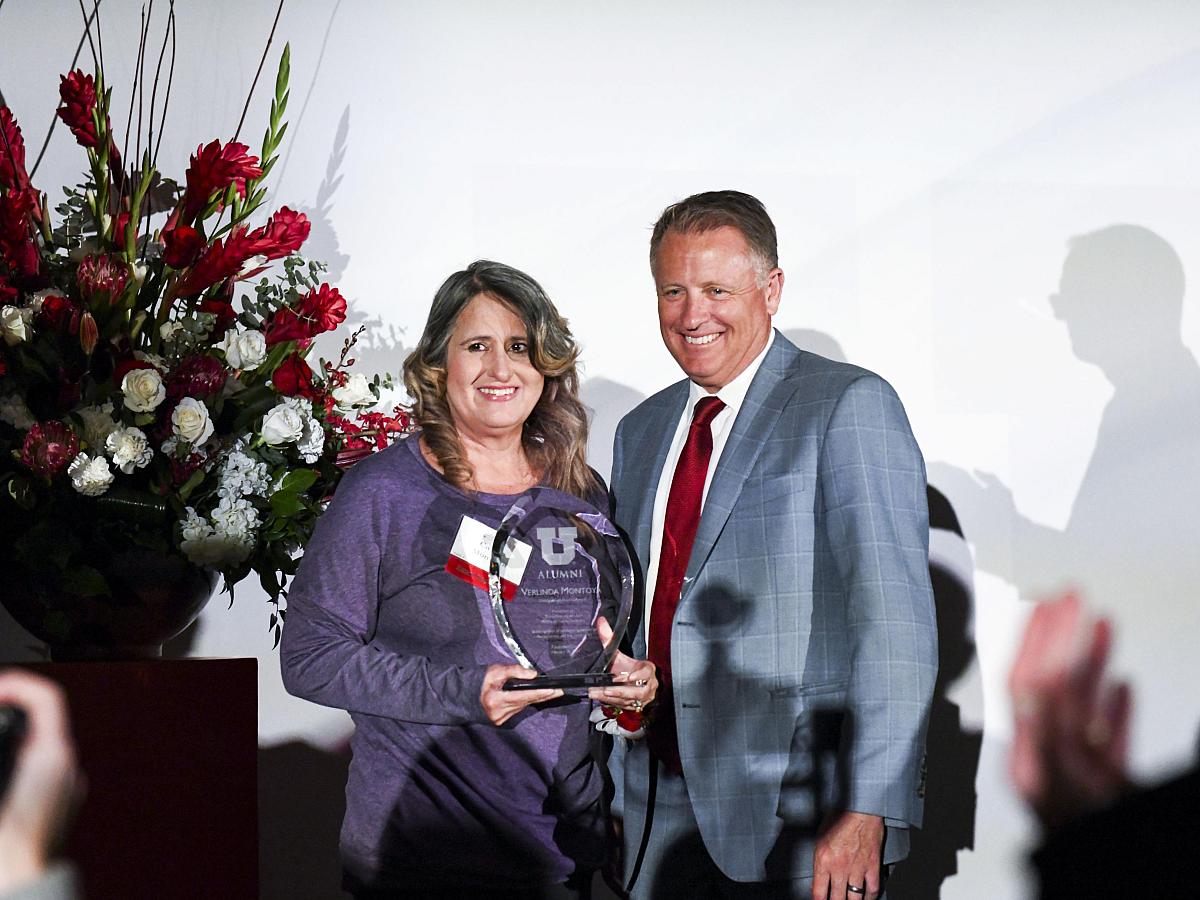 Carrie Montoya accepts the University of Utah Founders Day Distinguished Alumni Award on behalf of her mother
