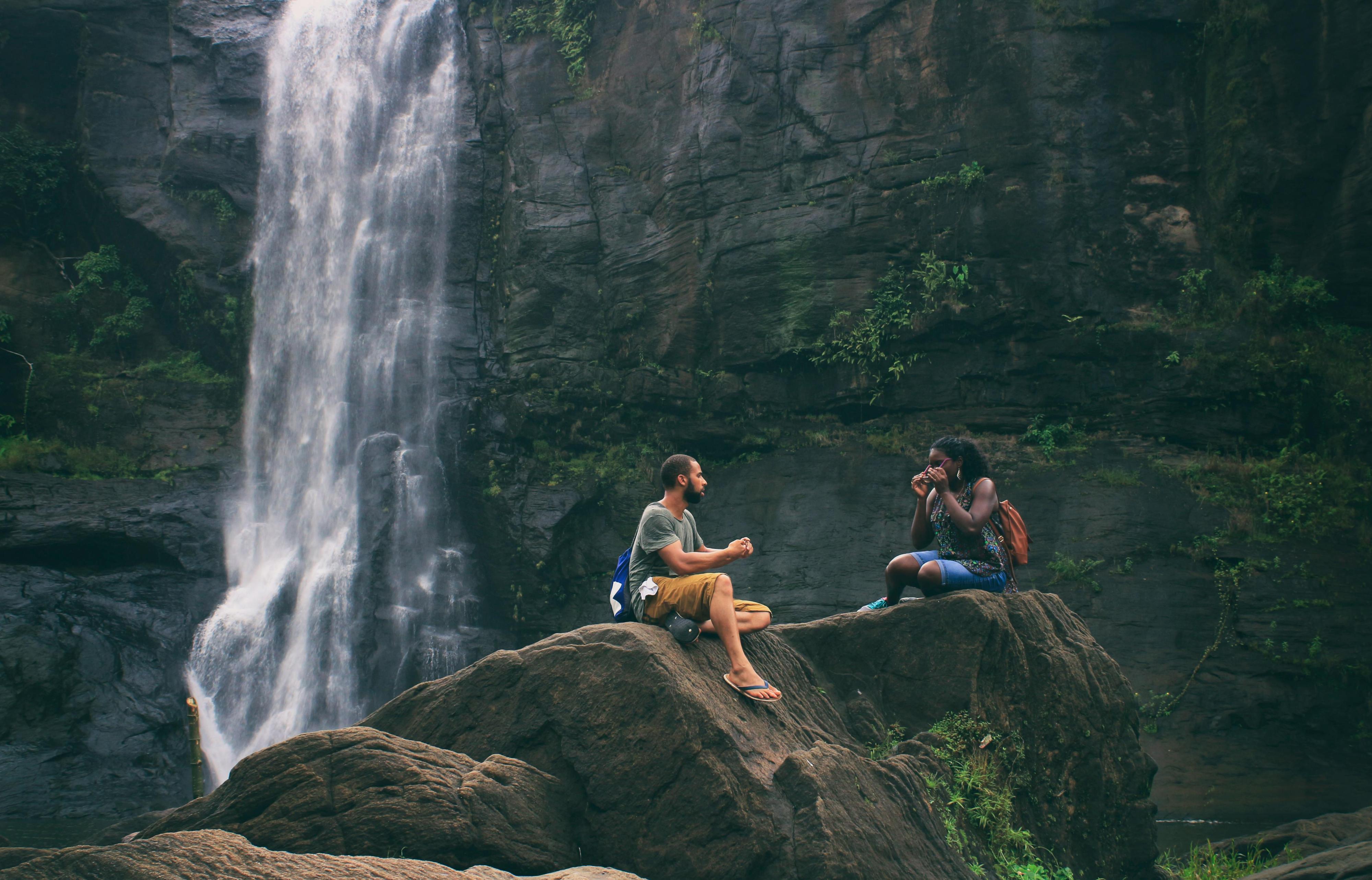 Man and Woman by Waterfall