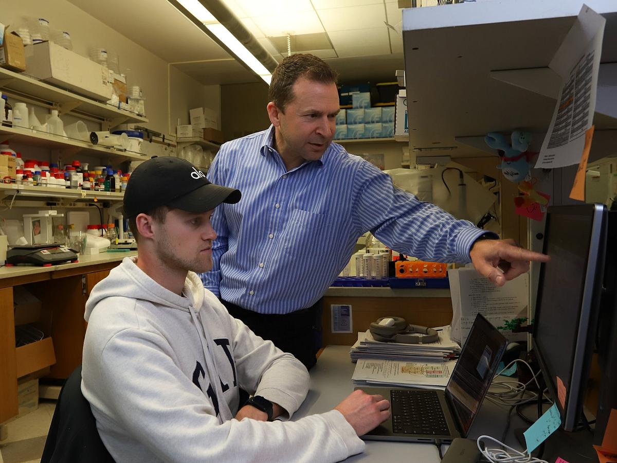 Drummond and student working in the lab