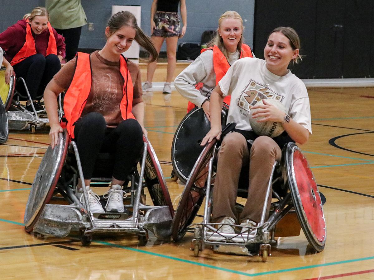 Women playing adaptive basketball