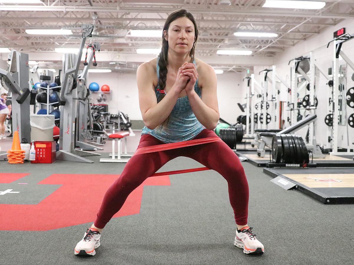 A woman doing lateral band walks