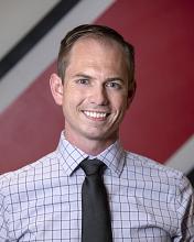 Headshot of David Bennion - Smiling in a shirt and tie
