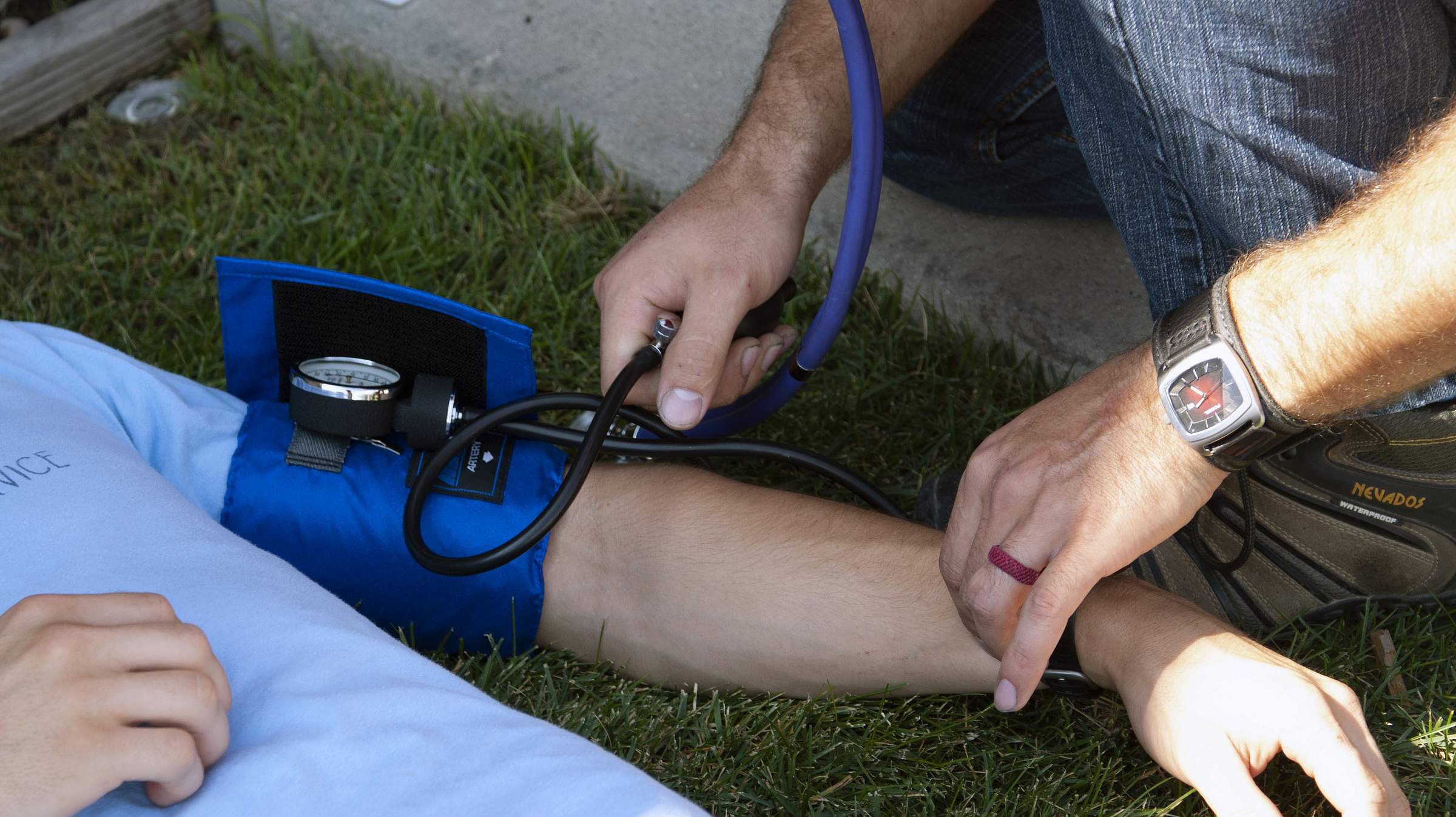 EMT student giving blood pressure